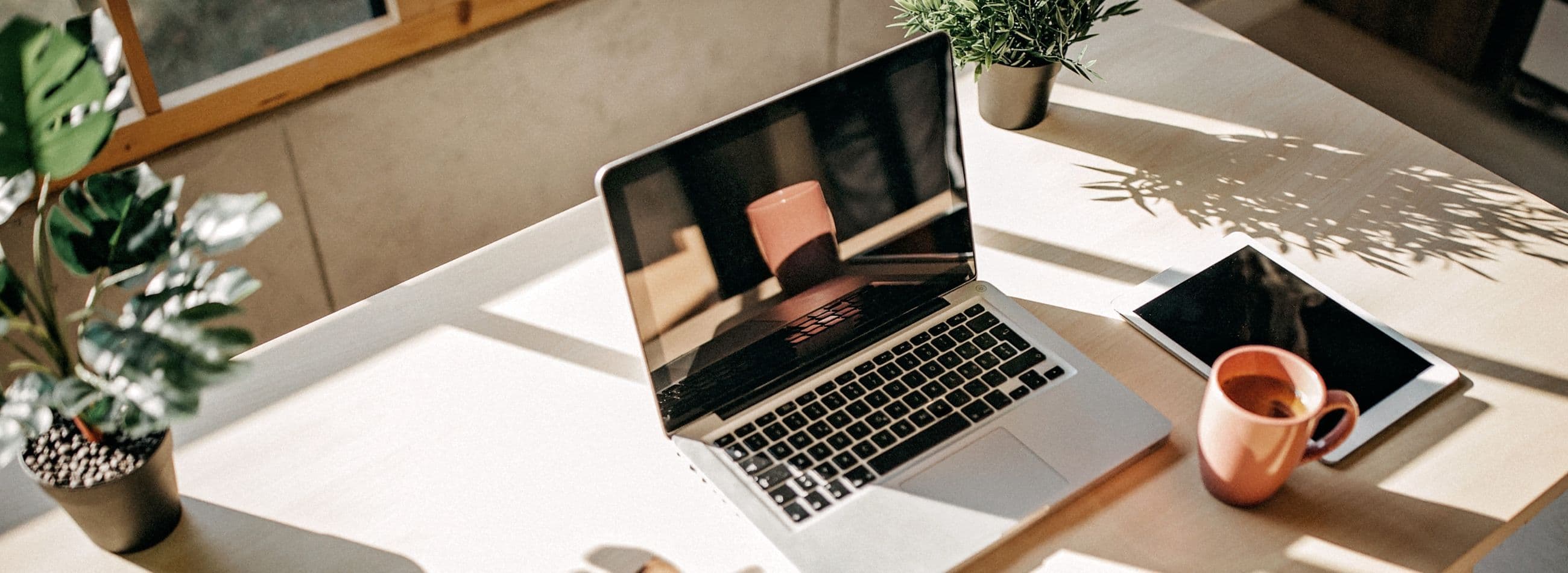 laptop on white desk