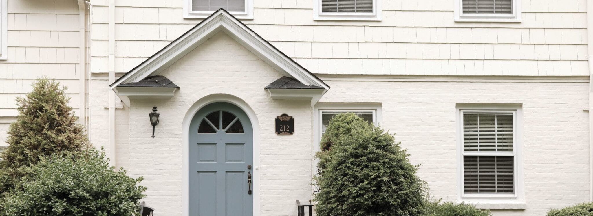 white home with blue front door