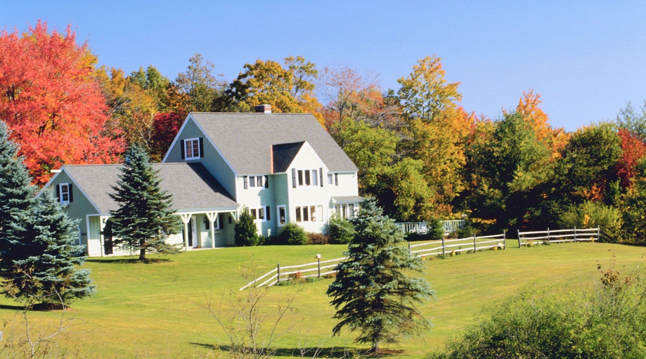 large white house on green lawn