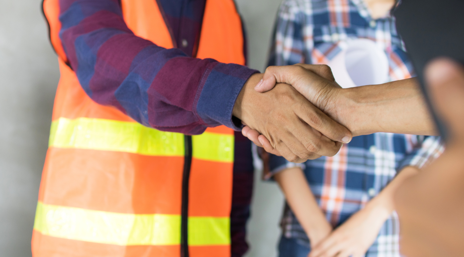 Homeowner shaking hands with contractor