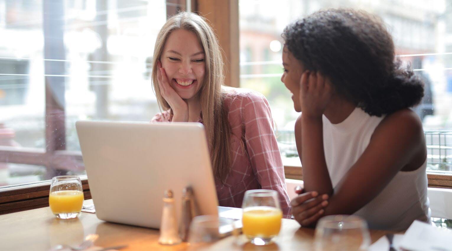 young women using laptop